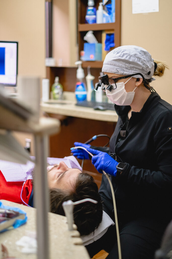 Dentist working on a man's teeth