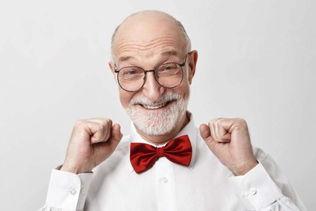Bald Bearded Elderly Male Dressed In Stylish Clothes Posing