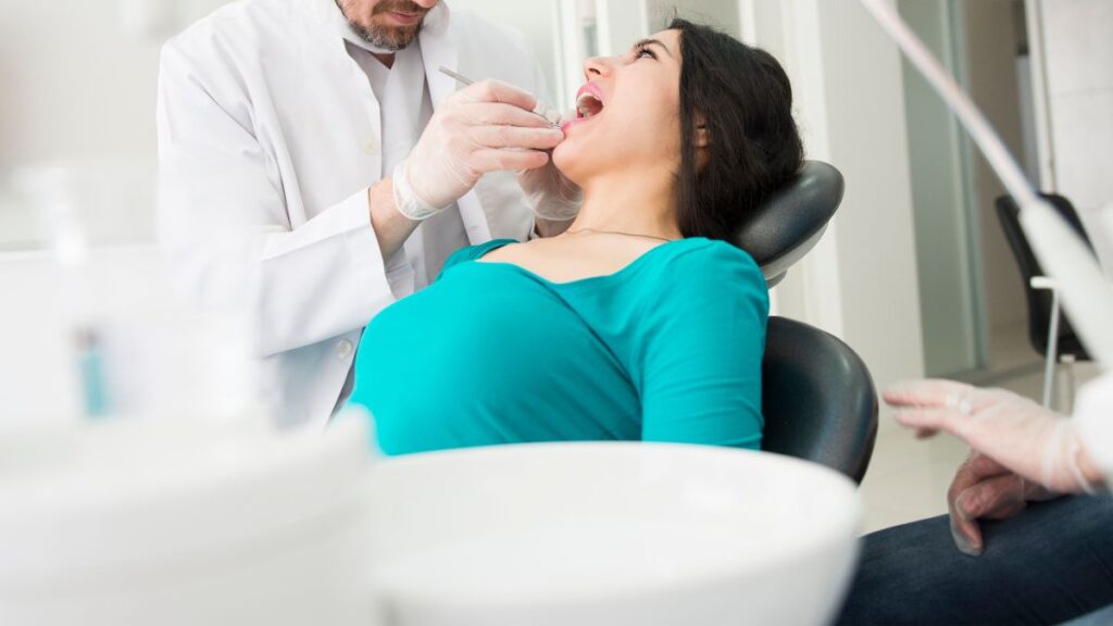 Patient Sitting On A Dental Chair For Treatment