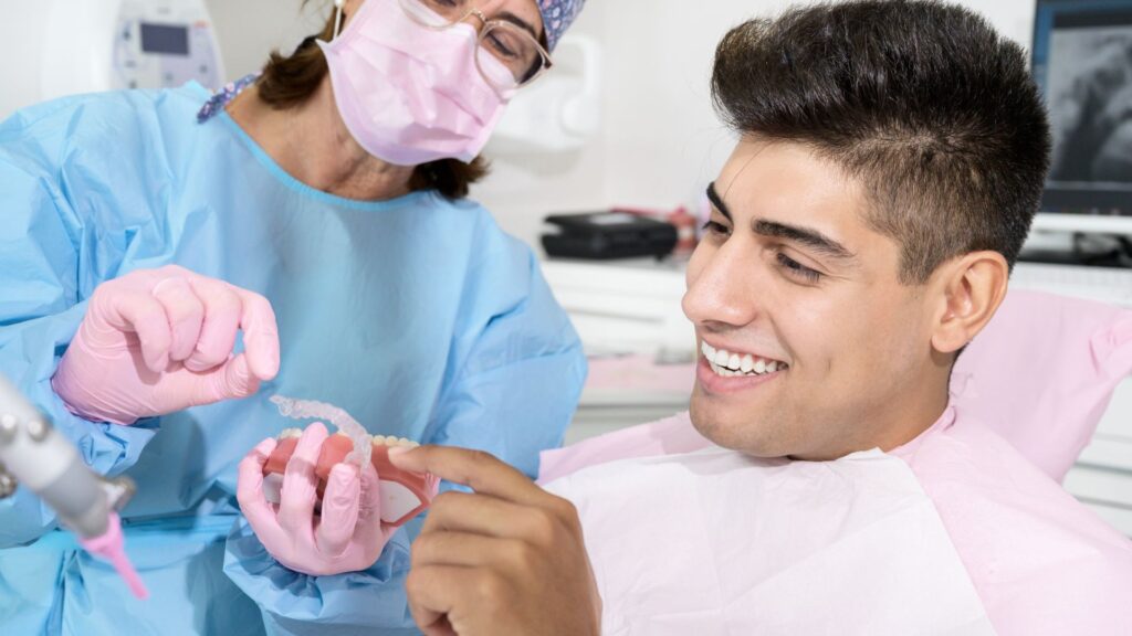 Dentist Explaining About Invisalign Treatment To Patient
