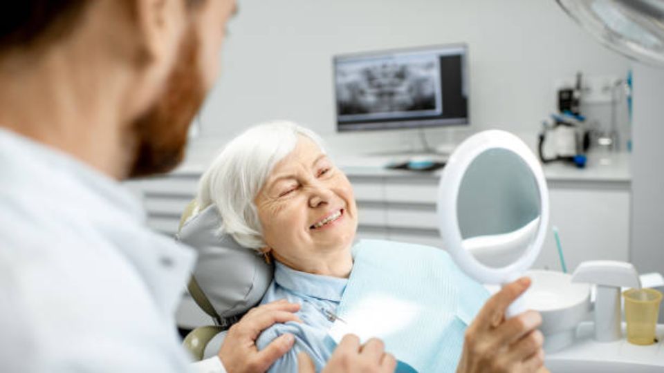 Elderly Woman Smiling After Getting Dental Implants