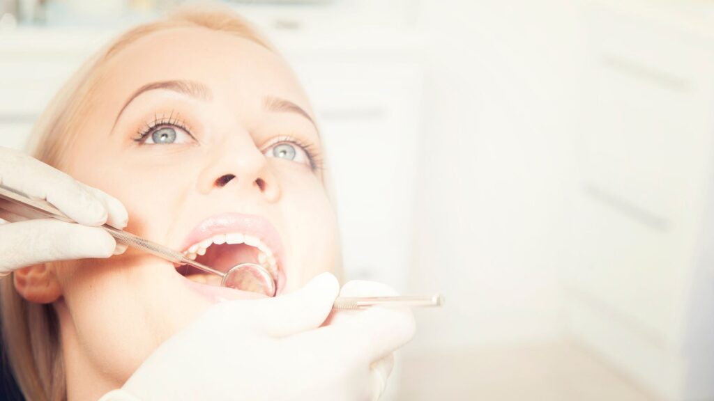 Patient Receiving A Dental Implant Treatment