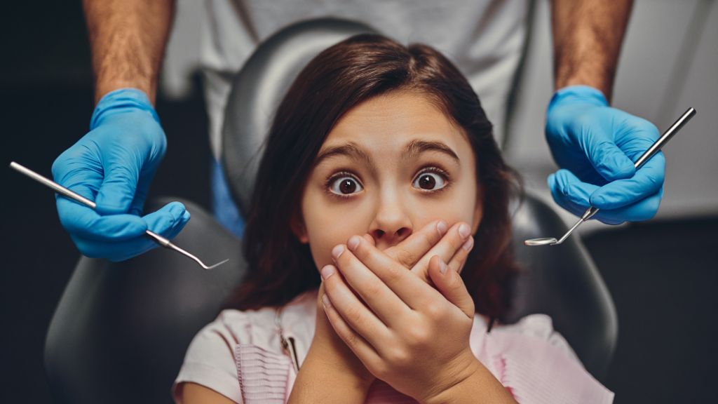 Girl Fearfully Awaits Dental Treatment