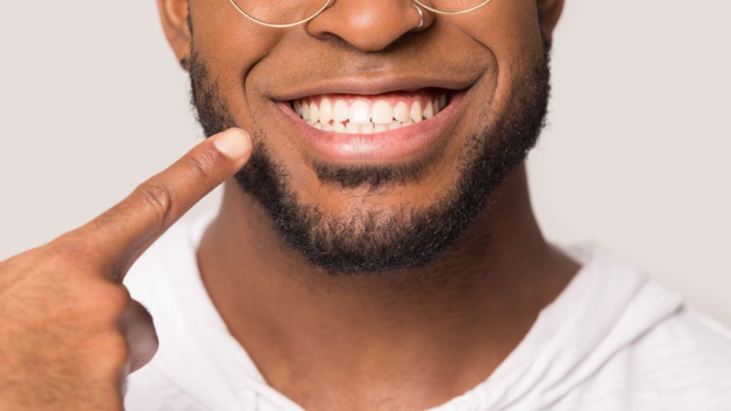 Person Smiling After Dental Cleaning