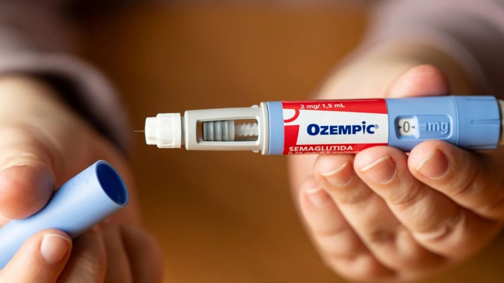 Person Holding An Ozempic Injection Pen